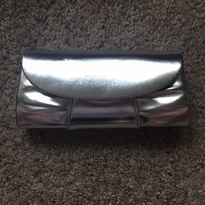 Shiny silver clutch